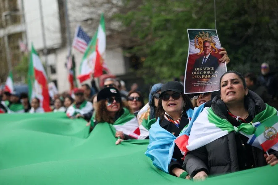 People take part in a protest against the Iranian government, amid the US-Israel conflict with Iran, in London, UK, on 4 April 2026. (Isabel Infantes/Reuters)
