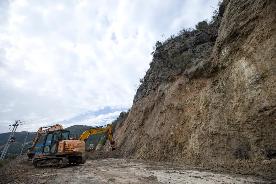 Workers repair the roads after Lingshi county, Jinzhong city, Shanxi province, China, was badly hit by floods, 12 October 2021. (CNS)