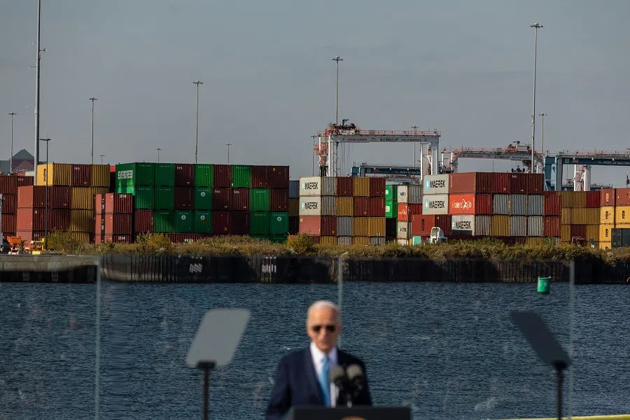 Shipping containers are seen as US President Joe Biden delivers remarks on his administration’s Investing in America agenda at the Port of Baltimore on 29 October 2024 in Baltimore, Maryland. (Anna Rose Layden/Getty Images via AFP)