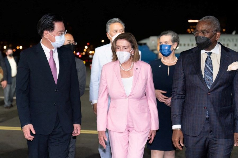 Taiwan Foreign Minister Joseph Wu welcomes US House of Representatives Speaker Nancy Pelosi at Taipei Songshan Airport in Taipei, Taiwan, 2 August 2022. (Taiwan Ministry of Foreign Affairs/Handout via Reuters)