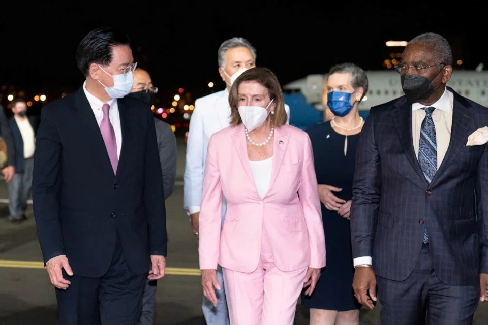 Taiwan Foreign Minister Joseph Wu welcomes US House of Representatives Speaker Nancy Pelosi at Taipei Songshan Airport in Taipei, Taiwan, 2 August 2022. (Taiwan Ministry of Foreign Affairs/Handout via Reuters)