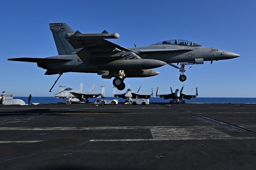 An F/A-18 Hornet fighter jet landing on the deck of the US Nimitz-class nuclear-powered aircraft carrier USS Harry S. Truman, during a NATO vigilance activity NEPTUNE SHIELD 2022 (NESH22) on the eastern Mediterranean Sea on 23 May 2022. (Andreas Solaro/AFP)