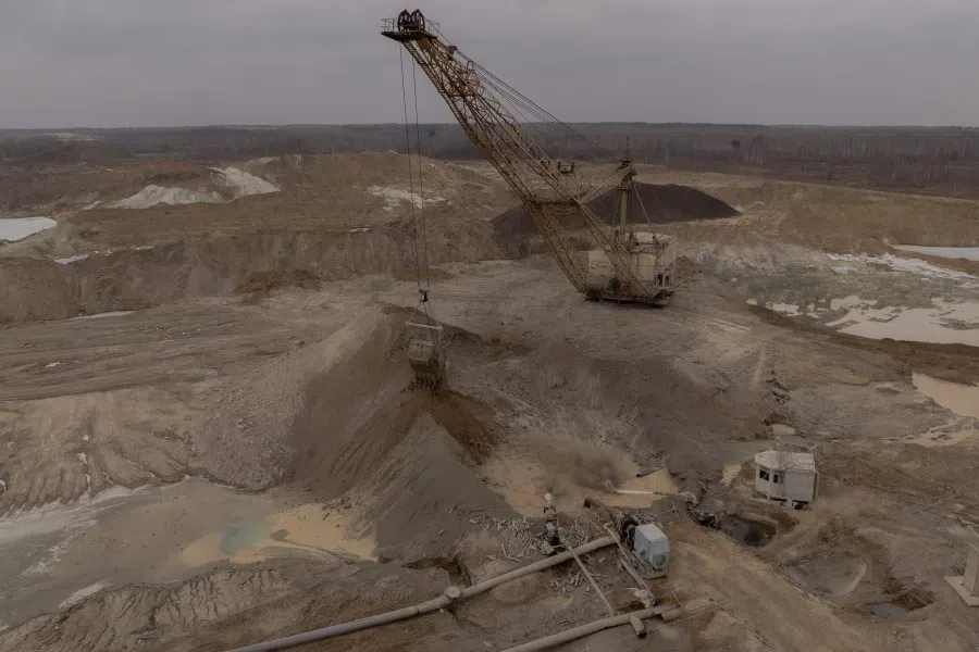 An aerial view shows a dragline excavator operating in an open-pit titanium mine in the Zhytomyr region, on 28 February 2025, amid the Russian invasion of Ukraine. (Roman Pilipey/AFP)