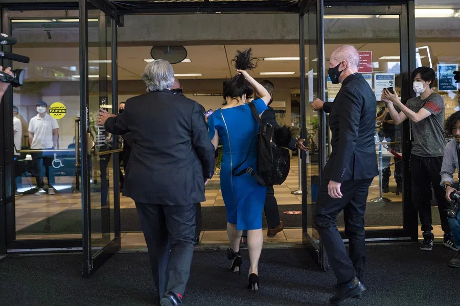 Meng Wanzhou, chief financial officer of Huawei (centre), arrives at the Supreme Court in Vancouver, British Columbia, Canada on 4 August 2021. (Jimmy Jeong/Bloomberg)