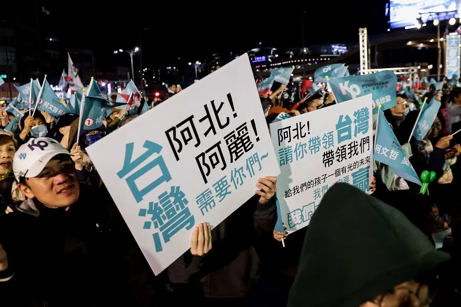 Supporters hold signs saying "Taiwan needs you, give our children a bright future" at an election campaign rally of Taiwan People's Party (TPP) in Keelung, Taiwan, on 10 January 2024. (I-Hwa Cheng/AFP)