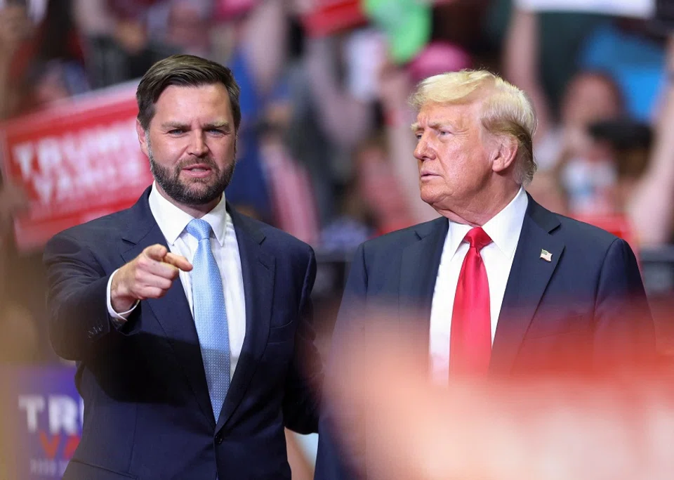 Republican presidential nominee and former US President Donald Trump stands with Republican vice-presidential nominee US senator JD Vance as he holds a rally for the first time with his running mate, in Grand Rapids, Michigan, US, on 20 July 2024. (Tom Brenner/Reuters)