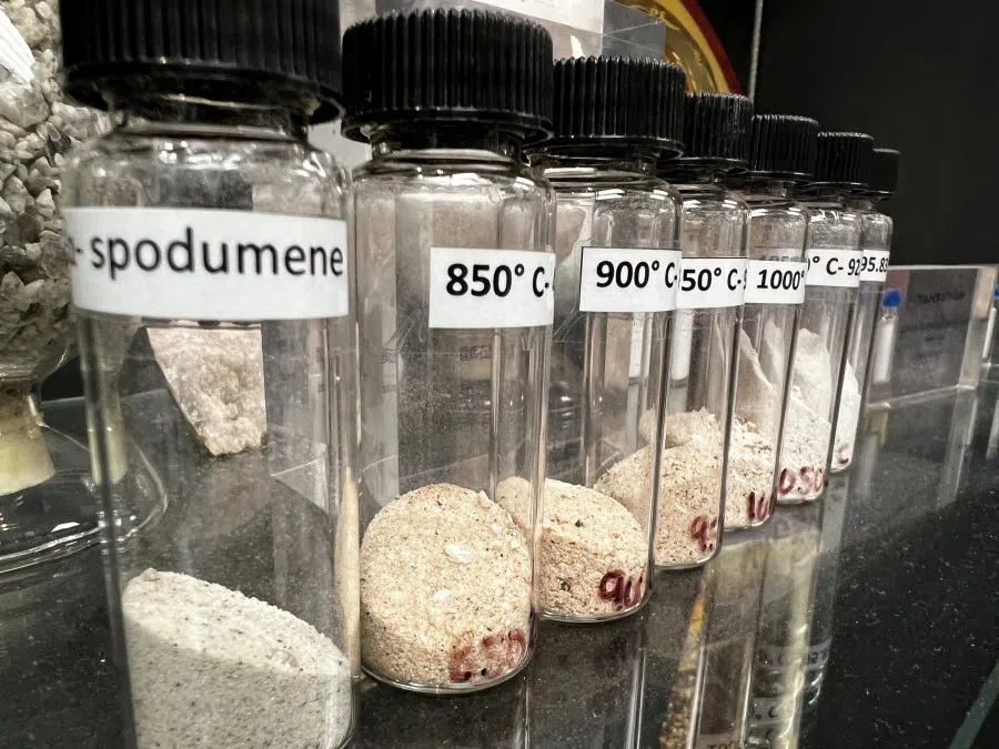 A display shows lithium ore spodumene, mined in Western Australia, which is used in the production of batteries for electric vehicles, in Perth, Australia, 24 May 2024. (Melanie Burton/Reuters)