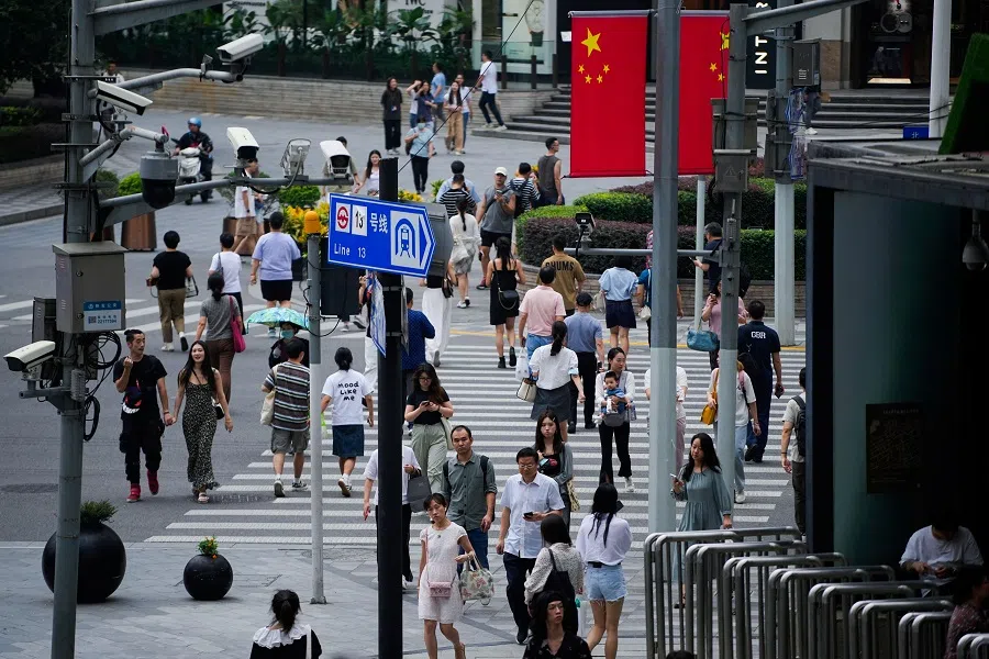 Chinese flags are seen on a street ahead of the National Day, in Shanghai, China, on 27 September 2023. (Aly Song/Reuters)