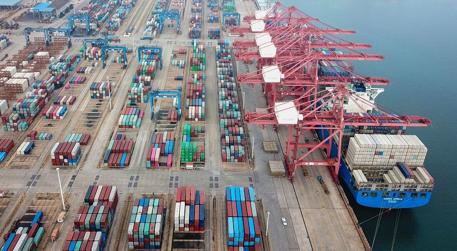 This aerial photo taken on 14 July 2020 shows containers stacked at a port in Lianyungang, Jiangsu, China. (STR/AFP)