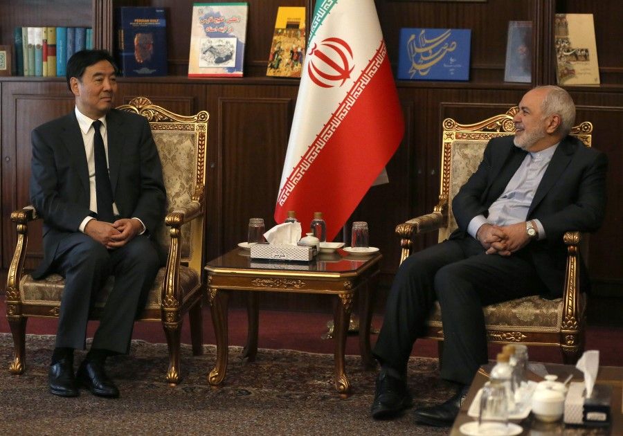Iran's Foreign Minister Mohammad Javad Zarif (R) meets with China's special envoy for Middle East affairs Zhai Jun in Tehran, on 22 October 2019. (Atta Kenare/AFP)
