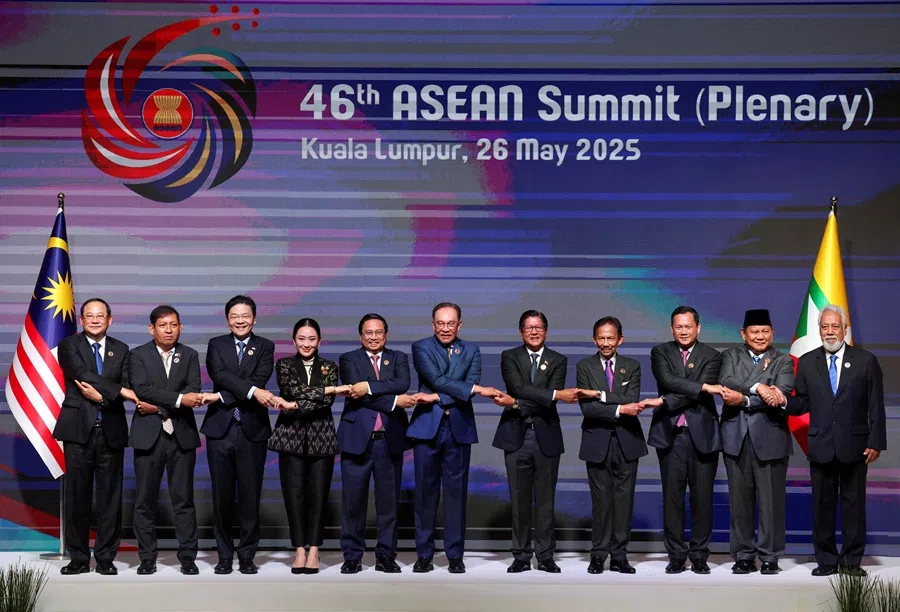 (from left to right) Laos’ Prime Minister Sonexay Siphandone, Myanmar’s permanent secretary of the Ministry of Foreign Affairs Aung Kyaw Moe, Singapore’s Prime Minister Lawrence Wong, Thailand’s Prime Minister Paetongtarn Shinawatra, Vietnam’s Prime Minister Pham Minh Chinh, Malaysia’s Prime Minister Anwar, Ibrahim, Philippines’ President Ferdinand Marcos Jr, Brunei’s Sultan Hassanal Bolkiah, Cambodia’s Prime Minister Hun Manet, Indonesian President Prabowo Subianto, and Prime Minister of Timor-Leste Xanana Gusmao join hands for a group photo as they attend the 46th ASEAN Summit, at the Kuala Lumpur Convention Centre in Kuala Lumpur, Malaysia, on 26 May 2025.  (Hasnoor Hussain/Reuters)