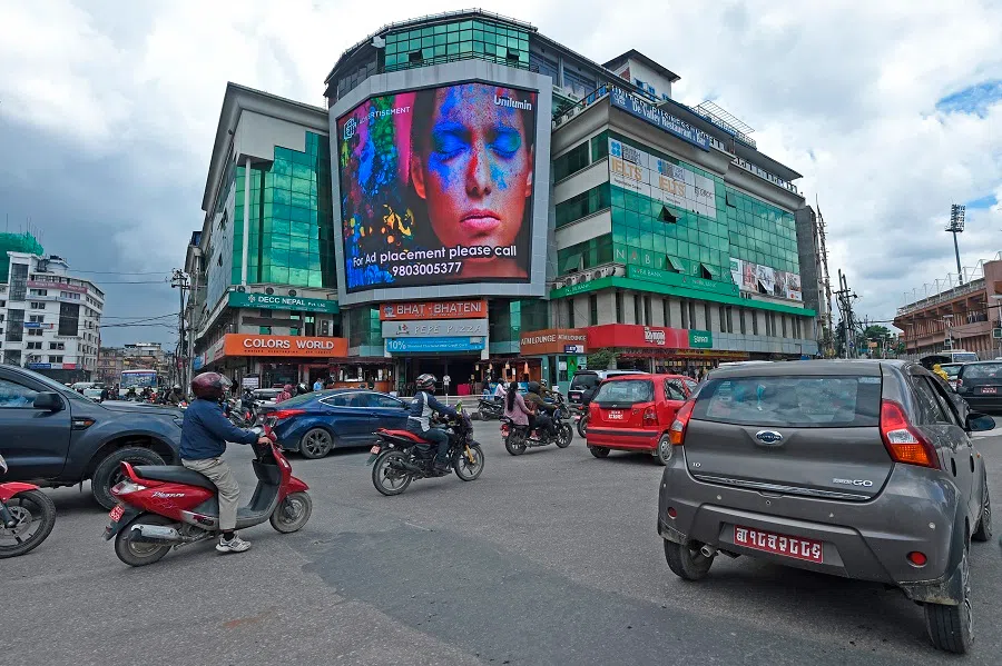 Vehicles move along a busy road after an end to the Covid-19 coronavirus lockdown in Kathmandu on 22 July 2020. (Prakash Mathema/AFP)
