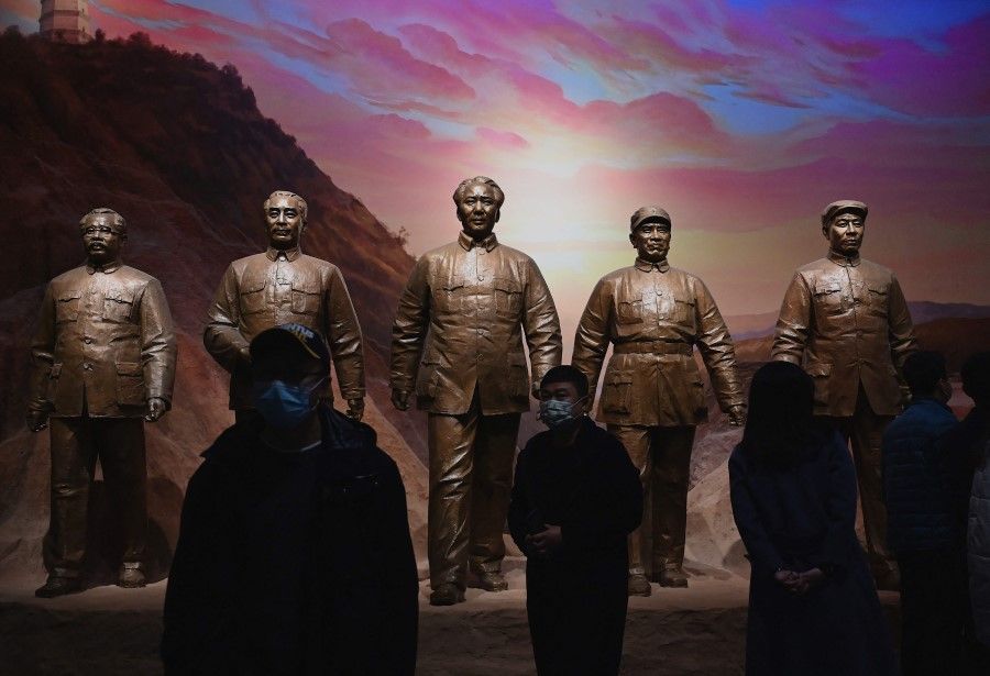 Visitors walk in front of statues of late Communist leader Mao Zedong (centre) and other leaders at the Museum of the Communist Party of China in Beijing on 11 November 2021. (Noel Celis/AFP)