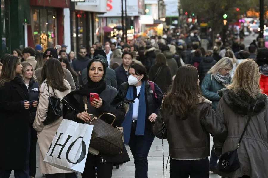 People walk on Oxford Street in London, Britain, 23 November 2025. (Jaimi Joy/Reuters)
