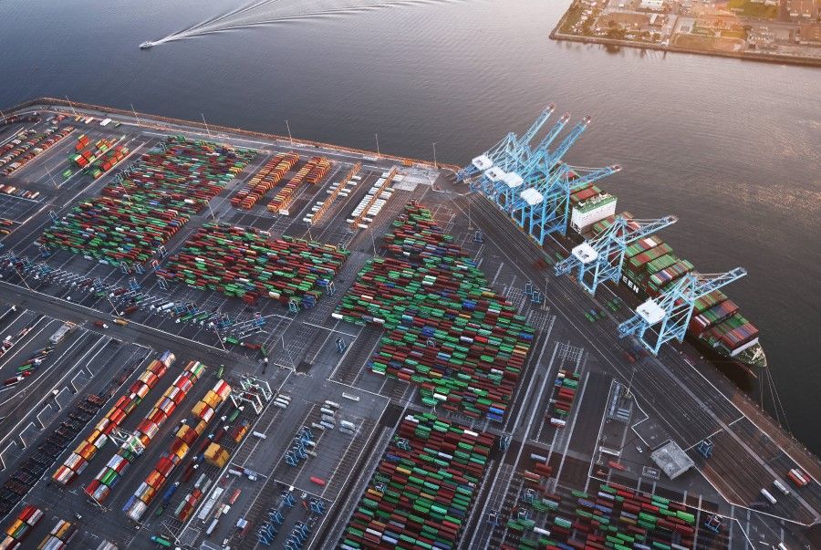 In an aerial view, shipping containers and a container ship are seen at the Port of Los Angeles on 20 September 2021 near Los Angeles, California. (Mario Tama/AFP)