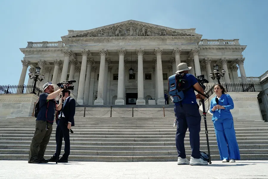 Members of the media work outside the US Capitol, on Capitol Hill in Washington, DC, US, on 3 July 2025. (Ken Cedeno/Reuters)