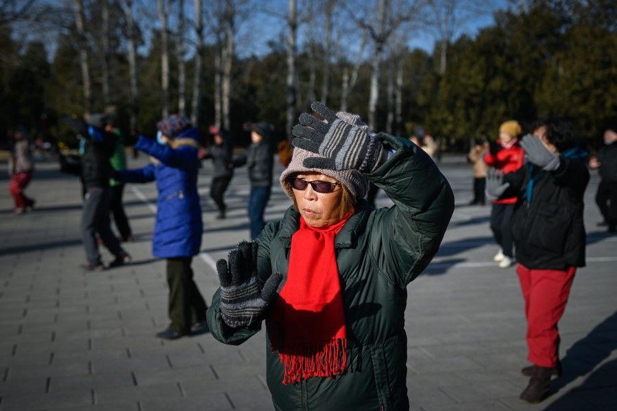 People exercise in a park in Beijing on 25 December 2020. (Wang Zhao/AFP)