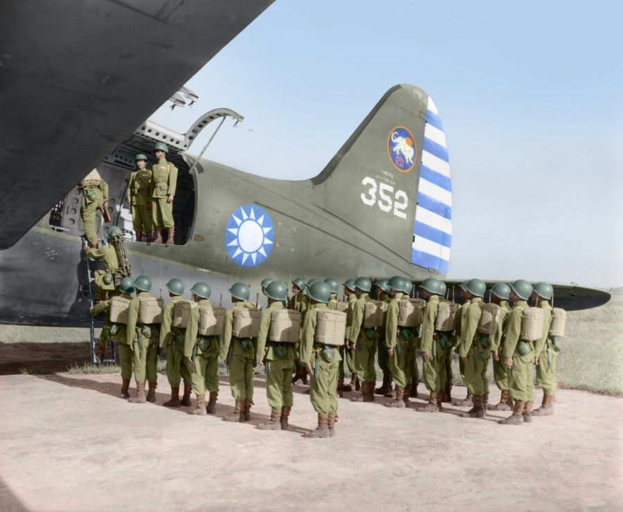 KMT soldiers in full gear boarding a C-46 transport aircraft on Fengshan, Kaohsiung, for airborne training, 1952.