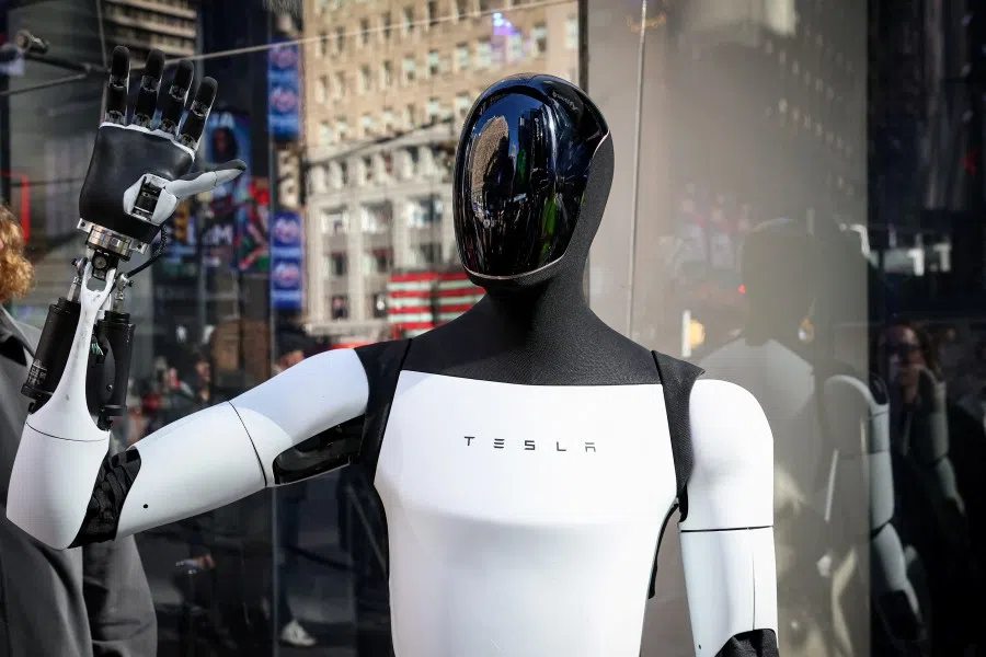 A Tesla Optimus robot walks during an appearance outside the Nasdaq Market site in New York City, US, on 27 October 2025. (Brendan McDermid/Reuters)