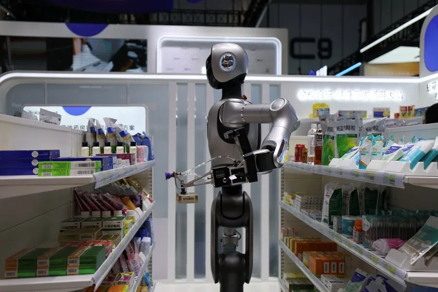 A Robbyant humanoid robot developed by Shanghai Ant Lingbo Technology, backed by Ant Group, demonstrates fetching medicine simulating a pharmacy environment, during the 2026 World Robot Conference, in Beijing, China, 19 August 2026.