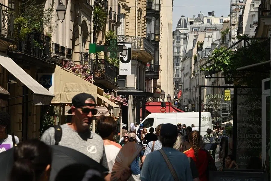 Pedestrians in central Paris, France, on 26 June 2026.