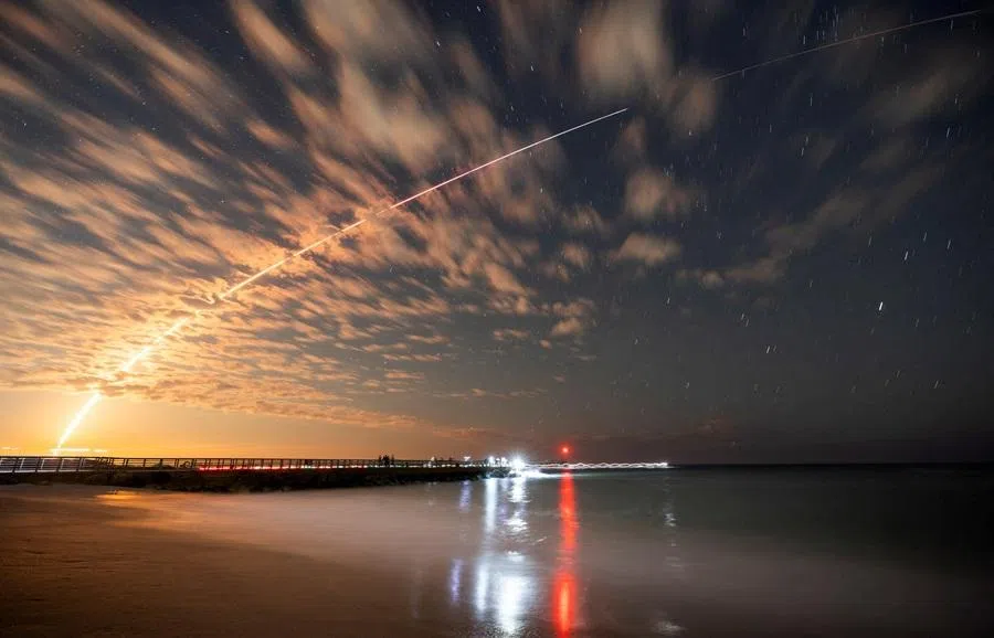 The SpaceX Falcon 9 rocket carrying Starlink satellites is seen over Sebastian Inlet after launching from Cape Canaveral, Florida, US, on 26 February 2025. (Sam Wolfe/Reuters)