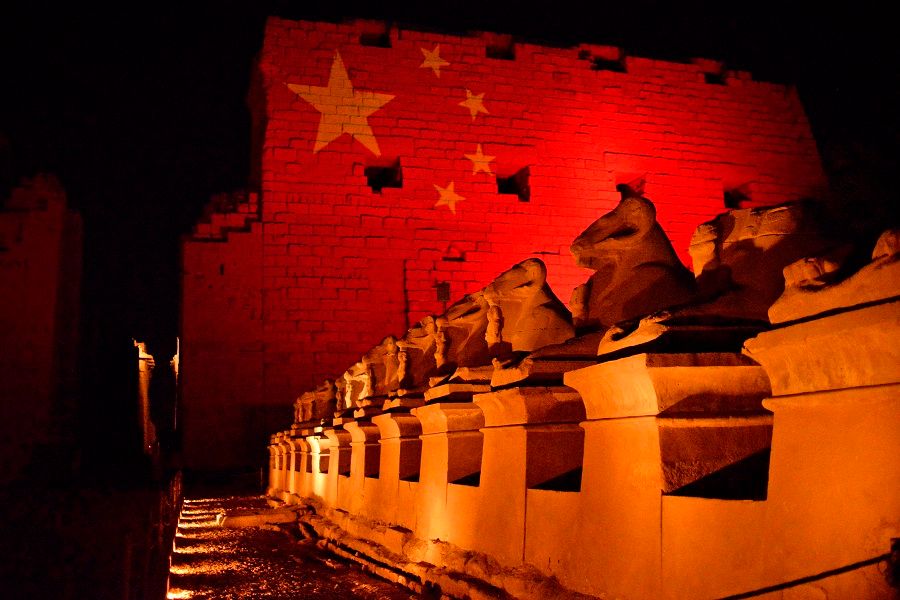 The Karnak Temple in Luxor, Egypt is pictured on 1 March 2020 with the Chinese flag projected on it in solidarity with the Chinese people amid the Covid-19 pandemic. (AFP)
