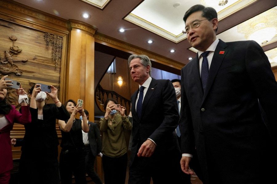 US Secretary of State Antony Blinken walks with Qin Gang at the Diaoyutai State Guesthouse in Beijing, China, on 18 June 2023. (Leah Millis/Pool/Reuters)