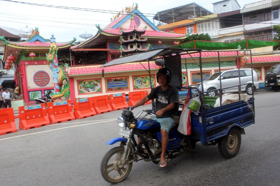 A man riding a motorcycle in Singkawang, West Kalimantan, Indonesia. (iStock)