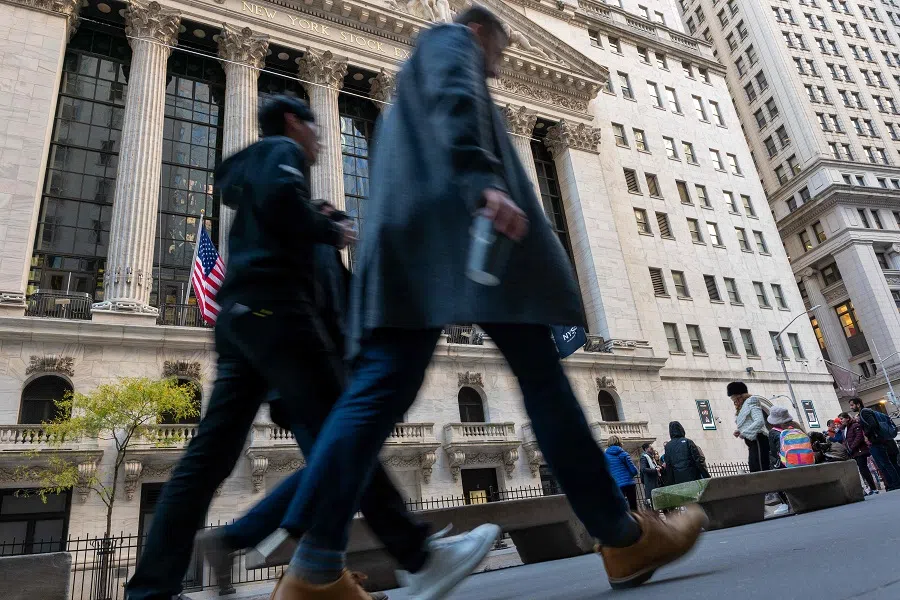 People walk by the New York Stock Exchange (NYSE) on 2 November 2023 in New York City, US. (Spencer Platt/Getty Images/AFP)