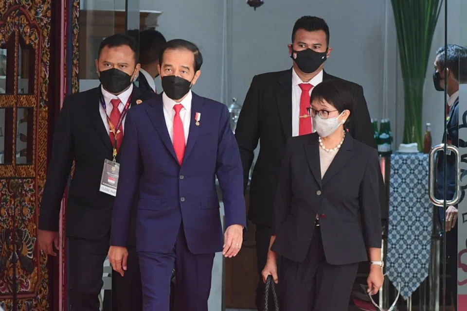 Indonesian President Joko Widodo and Indonesian Foreign Minister Retno Marsudi walk as they attend the ASEAN leaders' summit at the the Association of Southeast Asian Nations (ASEAN) secretariat building in Jakarta, Indonesia, 24 April 2021. (Muchlis Jr/Indonesian Presidential Palace/Handout via Reuters)