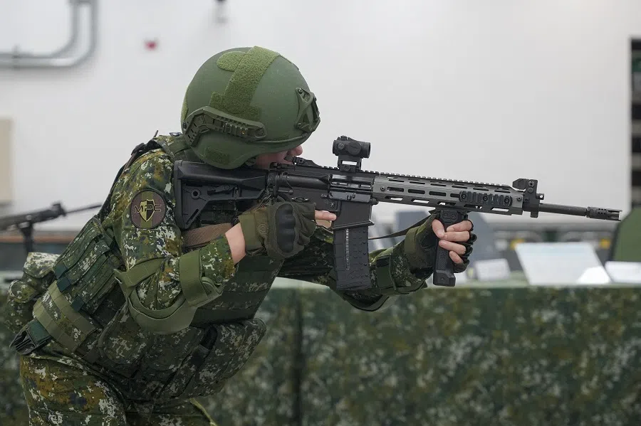 A soldier handles a T112 assault rifle manufactured by Taiwan’s 205th Arsenal during the firearm’s introduction to the media at the armoury in Kaohsiung, Taiwan, on 9 October 2024. (Walid Berrazeg/AFP)