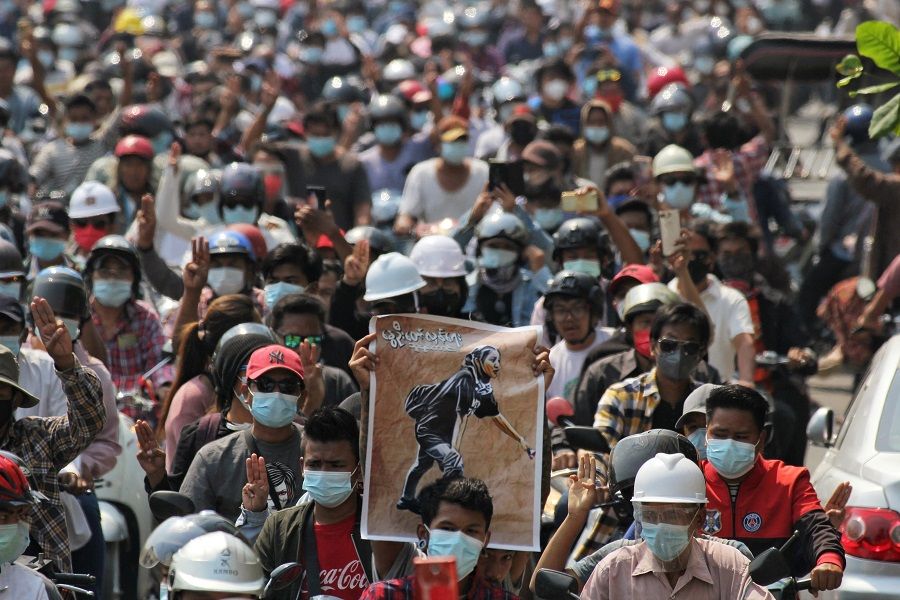 People attend the funeral of Angel, a 19-year-old protester also known as Kyal Sin, who was shot in the head as Myanmar forces opened fire to disperse an anti-coup demonstration in Mandalay, Myanmar, 4 March 2021. (Stringer/Reuters)