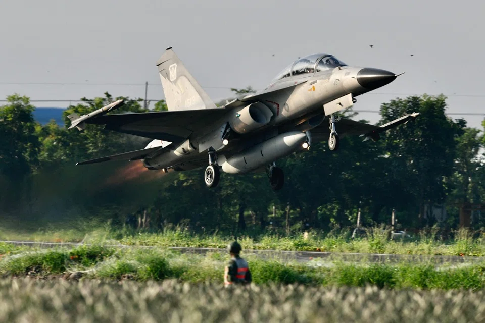 An armed homemade Indigenous Defense Fighter (IDF) takes off from a motorway in Pingtung, Taiwan, during the annual Han Kuang drill on 15 September 2021. (Sam Yeh/AFP)