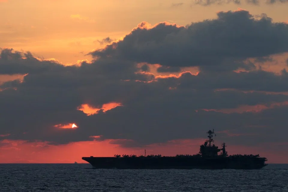 The U.S. Navy aircraft carrier USS John C. Stennis transits the South China Sea at sunset, 25 February 2019. (US Navy/Mass Communication Specialist 1st Class Ryan D. McLearnon/Handout via REUTERS)