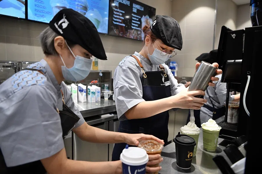Staff prepare drinks at a Luckin Coffee outlet in Singapore. (SPH Media)