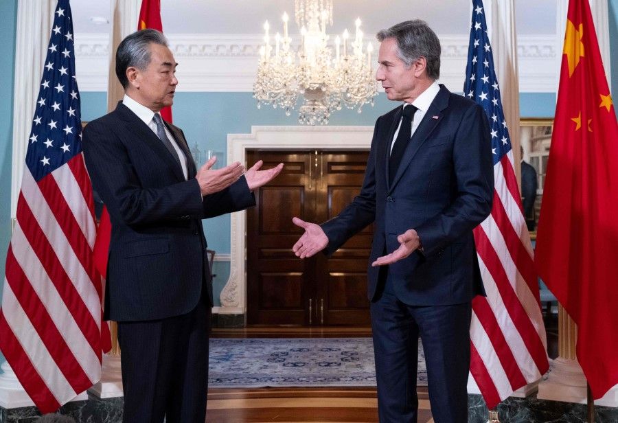 US Secretary of State Antony Blinken speaks with Chinese Foreign Minister Wang Yi prior to meetings at the State Department in Washington, DC, on 26 October 2023. (Saul Loeb/AFP)
