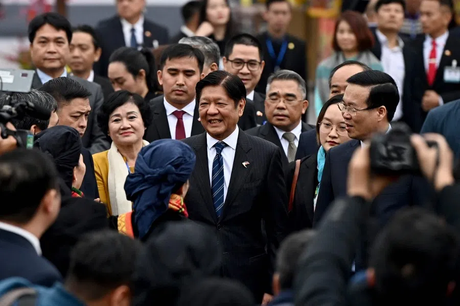 Philippine President Ferdinand Marcos (centre) with Vietnam's President Vo Van Thuong (right) at Thang Long Imperial Citadel in Hanoi on 30 January 2024. (Nhac Nguyen/AFP)