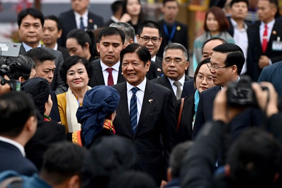 Philippine President Ferdinand Marcos (centre) with Vietnam's President Vo Van Thuong (right) at Thang Long Imperial Citadel in Hanoi on 30 January 2024. (Nhac Nguyen/AFP)