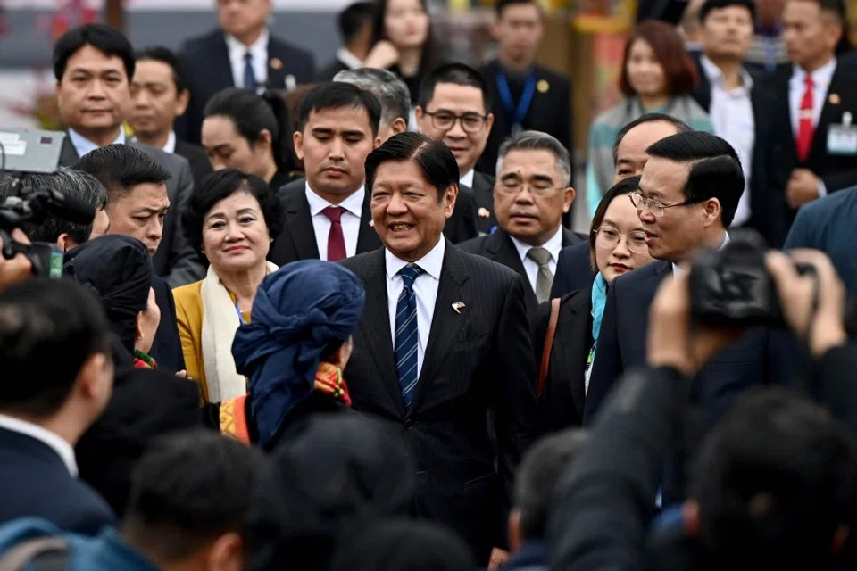 Philippine President Ferdinand Marcos (centre) with Vietnam's President Vo Van Thuong (right) at Thang Long Imperial Citadel in Hanoi on 30 January 2024. (Nhac Nguyen/AFP)