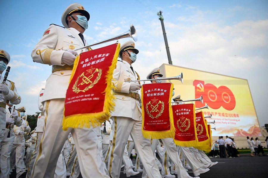 A Chinese military band arrives for celebrations in Beijing, China, on 1 July 2021, to mark the 100th anniversary of the founding of the Communist Party of China. (Wang Zhao/AFP)