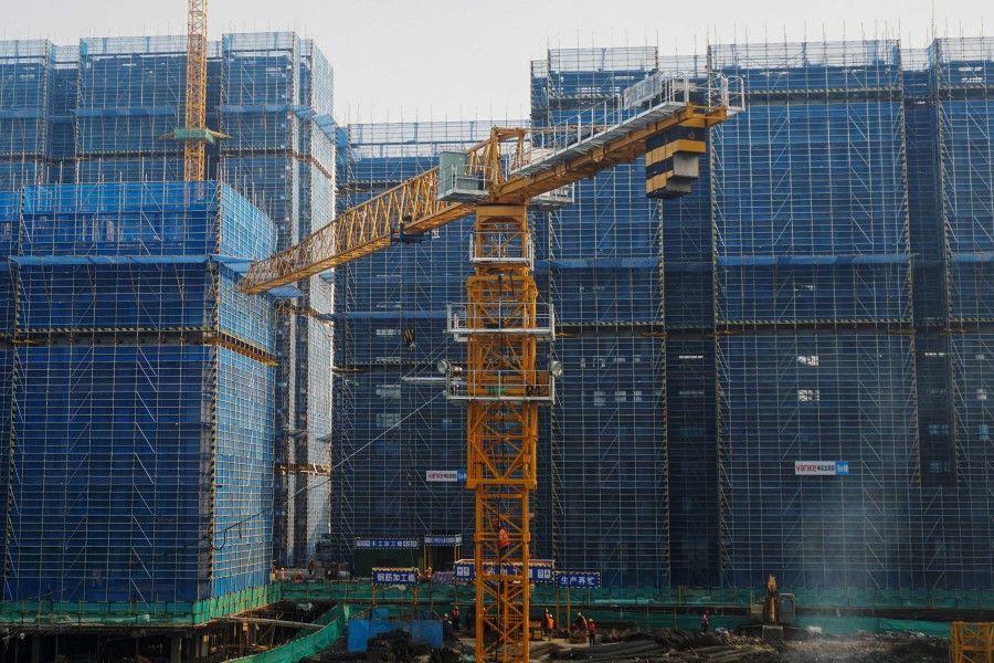 This photo taken on 31 March 2024 shows residential buildings under construction by Chinese real estate developer Vanke in Hangzhou, in eastern China's Zhejiang province. (AFP)