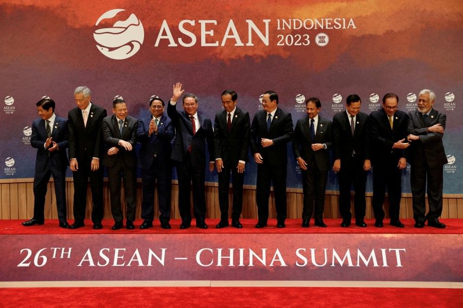 Chinese Premier Li Qiang (fifth from left) waves after a family photo with ASEAN leaders before the start of the ASEAN-China Summit in Jakarta, Indonesia, 6 September 2023. (Willy Kurniawan/Reuters)