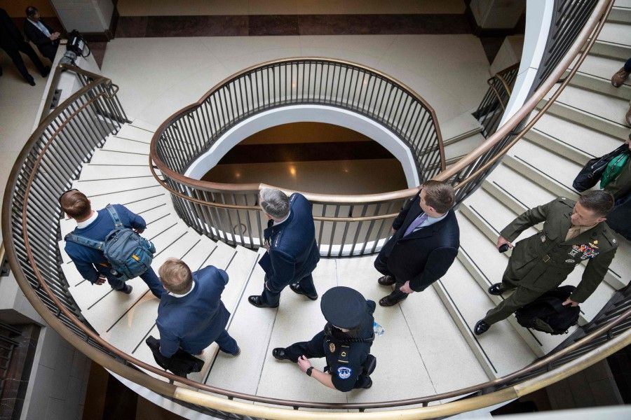 Security and military officials arrive for a closed-door briefing for senators about the Chinese spy balloon at the US Capitol, 9 February 2023 in Washington, DC. (Drew Angerer/AFP)