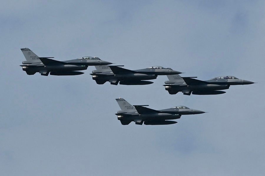 Four upgraded US-made F-16V fighters fly during a demonstration at a ceremony at the Chiayi Air Base in Taiwan on 18 November 2021. (Sam Yeh/AFP)
