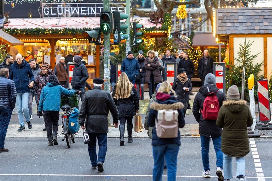 Visitors at a Christmas market in Berlin, Germany, on 14 December 2023. (Krisztian Bocsi/Bloomberg)
