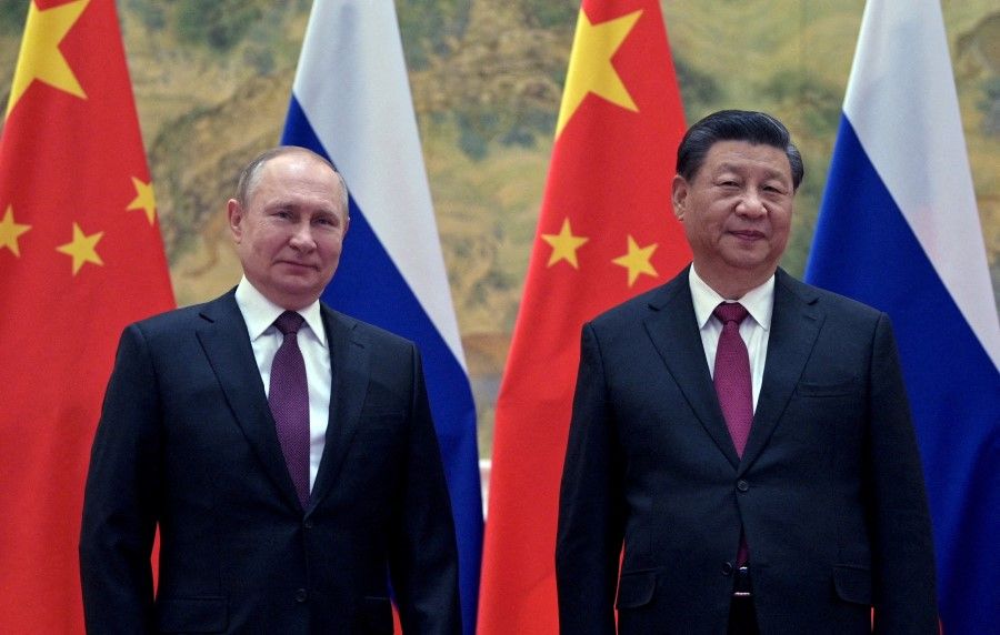 Russian President Vladimir Putin attends a meeting with Chinese President Xi Jinping in Beijing, China, 4 February 2022. (Sputnik/Aleksey Druzhinin/Kremlin via Reuters)