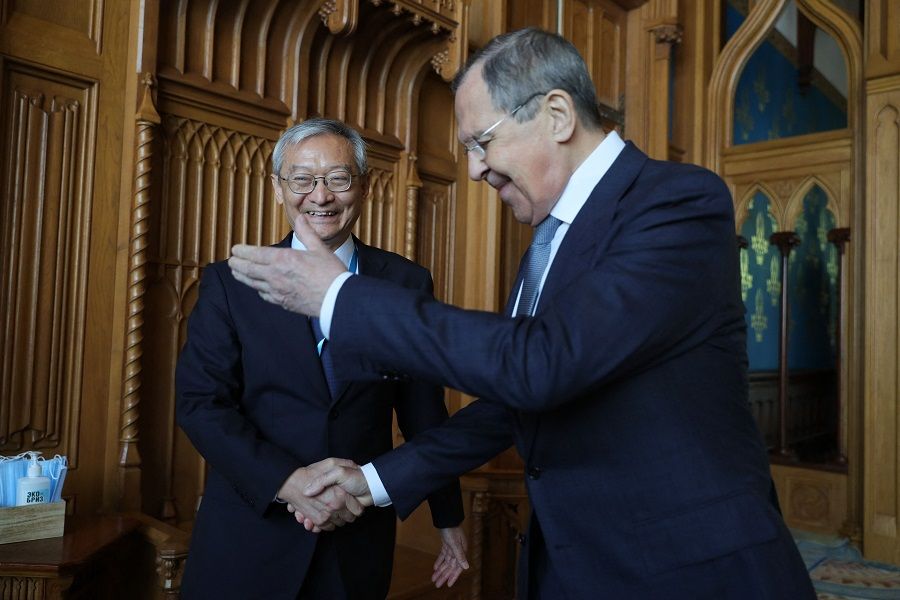 Russian Foreign Minister Sergei Lavrov meets with Shanghai Cooperation Organisation (SCO) Secretary-General Zhang Ming in Moscow, Russia, on 18 May 2022. (Handout/Russian Foreign Ministry/AFP)