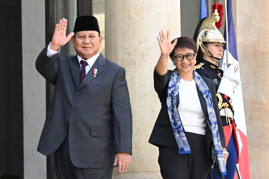 Indonesia's Defence Minister Prabowo Subianto (left) and Indonesian Foreign Minister Retno Marsudi (right) gesture at the entrance of the Elysee Palace in Paris on 21 July 2023, amid a visit to France to discuss "strategic and economic cooperation". (Bertrand Guay/AFP)
