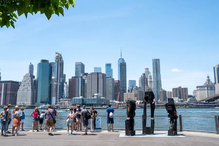 People walk through Brooklyn on 31 May 2022 in New York City, US. (Spencer Platt/Getty Images/AFP)